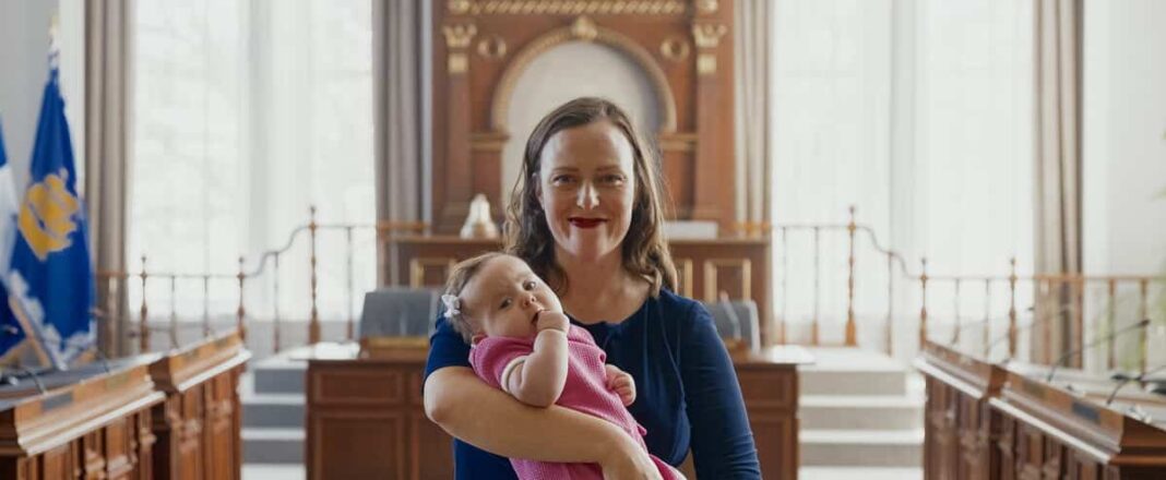 Quebec City Hall: Jackie Smith sits with her 4-month-old daughter

