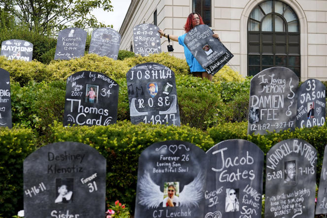 Cardboard tombstones with the names of opioid victims outside the courthouse, during the bankruptcy of Purdue Pharma, accused of promoting a painkiller, in New York, on August 9, 2021. 